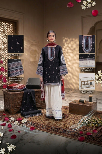A woman models a traditional South Asian outfit in an ornate indoor setting. The outfit consists of a dark navy embroidered kurta with white and red patterns, paired with white wide-leg pants and a dark navy dupatta.